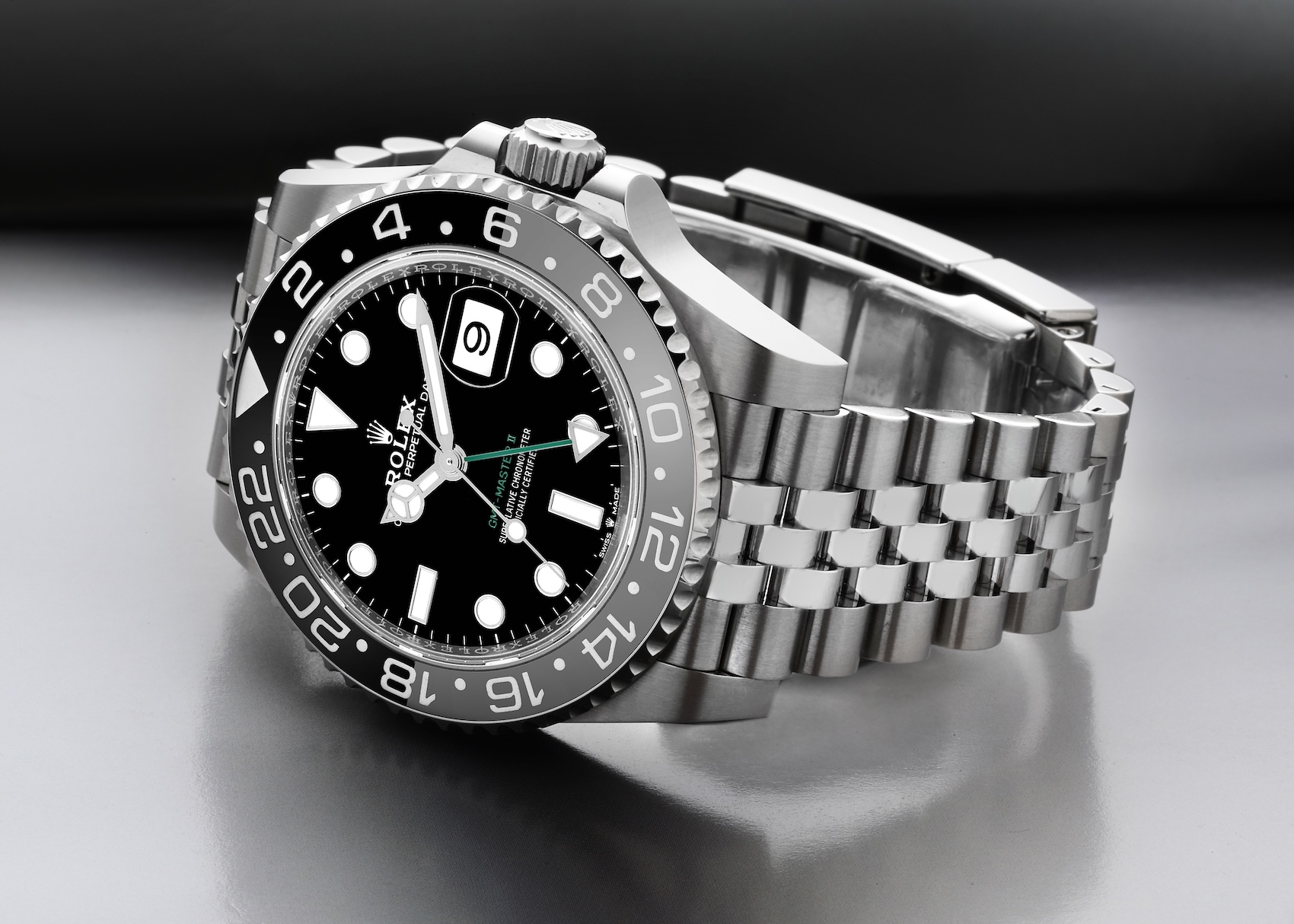 Close-up of the Rolex GMT-Master II Bruce Wayne reference 126710GRNR in stainless steel featuring a grey and black Cerachrom bezel on a Jubilee bracelet.