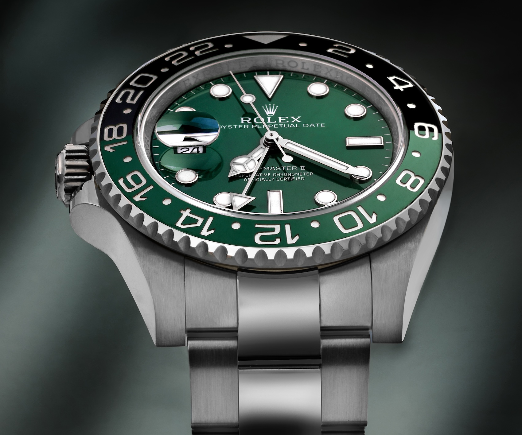 Left-handed Rolex GMT-Master II Sprite reference 126720VTNR featuring a green and black Cerachrom bezel and destro crown configuration.