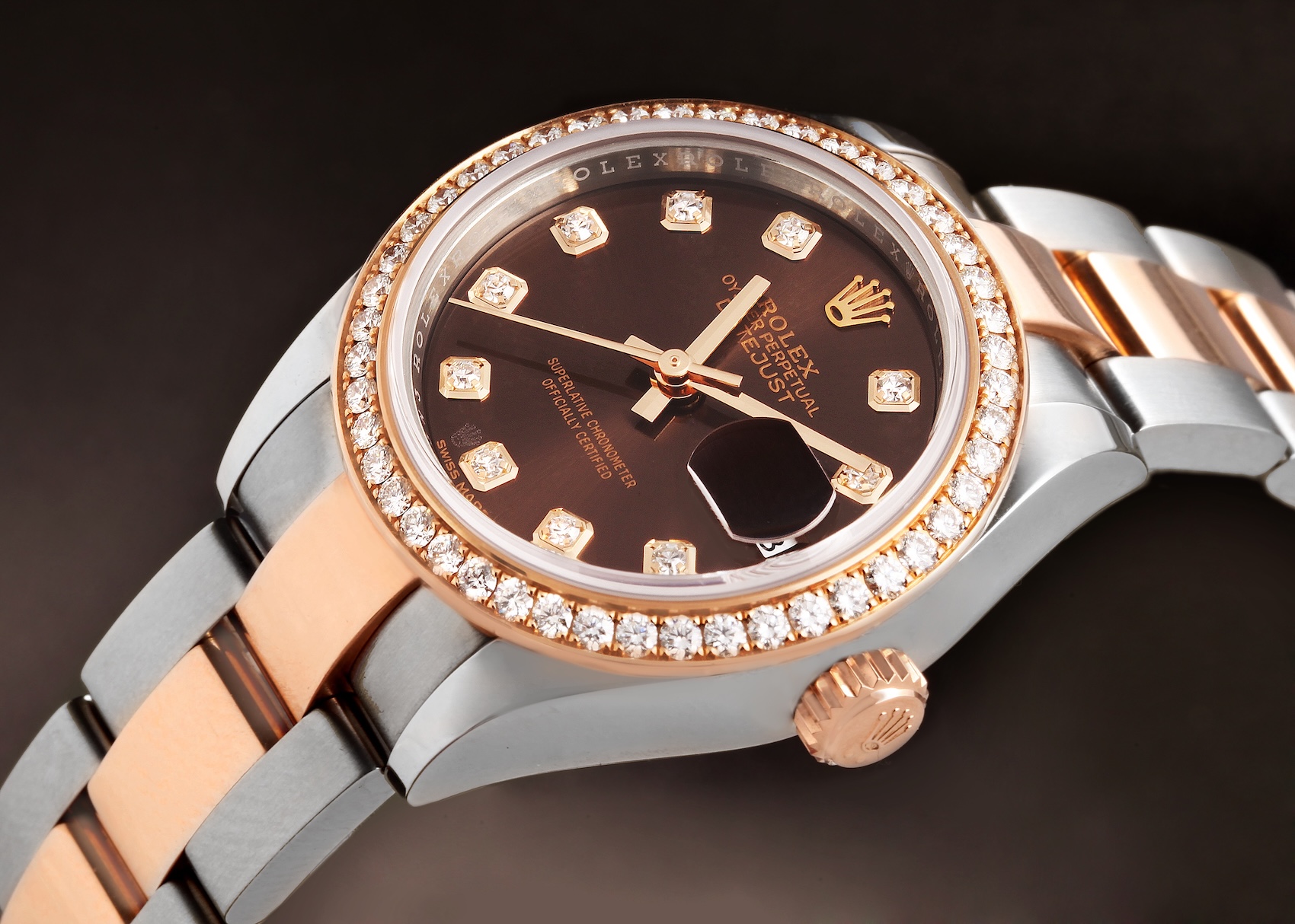 Rolex Lady-Datejust 28mm Oystersteel and 18k Everose gold watch 279381 featuring a chocolate brown dial, factory diamond hour markers, diamond bezel, and Oyster bracelet.